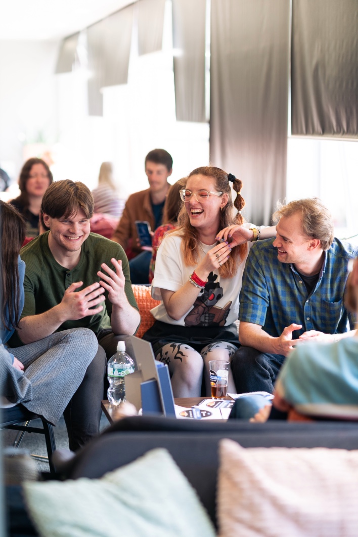 Group laughing on sofas