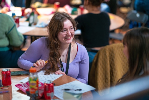 Woman smiling at table